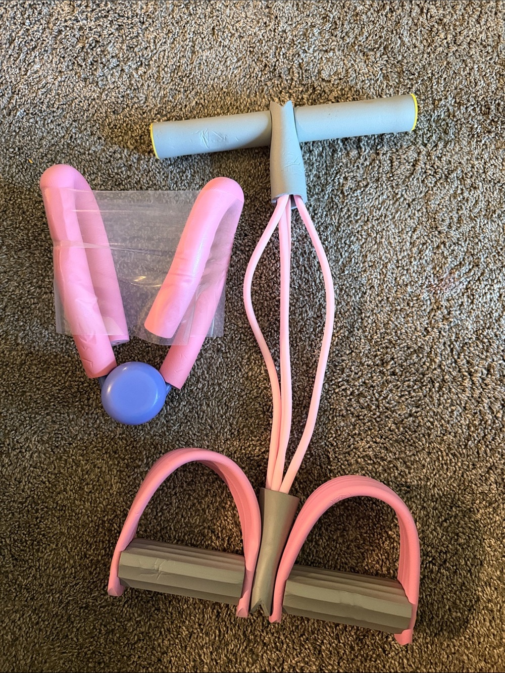 Pink and Gray Resistance Tube with Foot Pedals and Handle